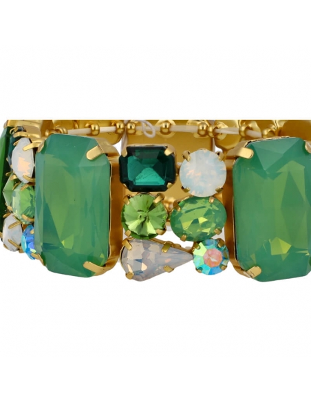 Golden woman bracelet with crystal in green color